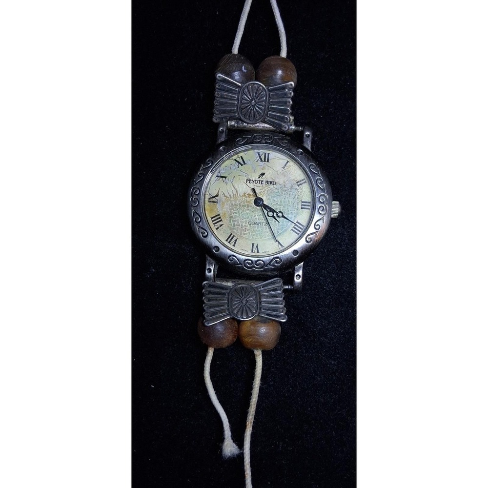 Peyote Bird wristwatch Face sterling silver cream dial with Roman numerals.